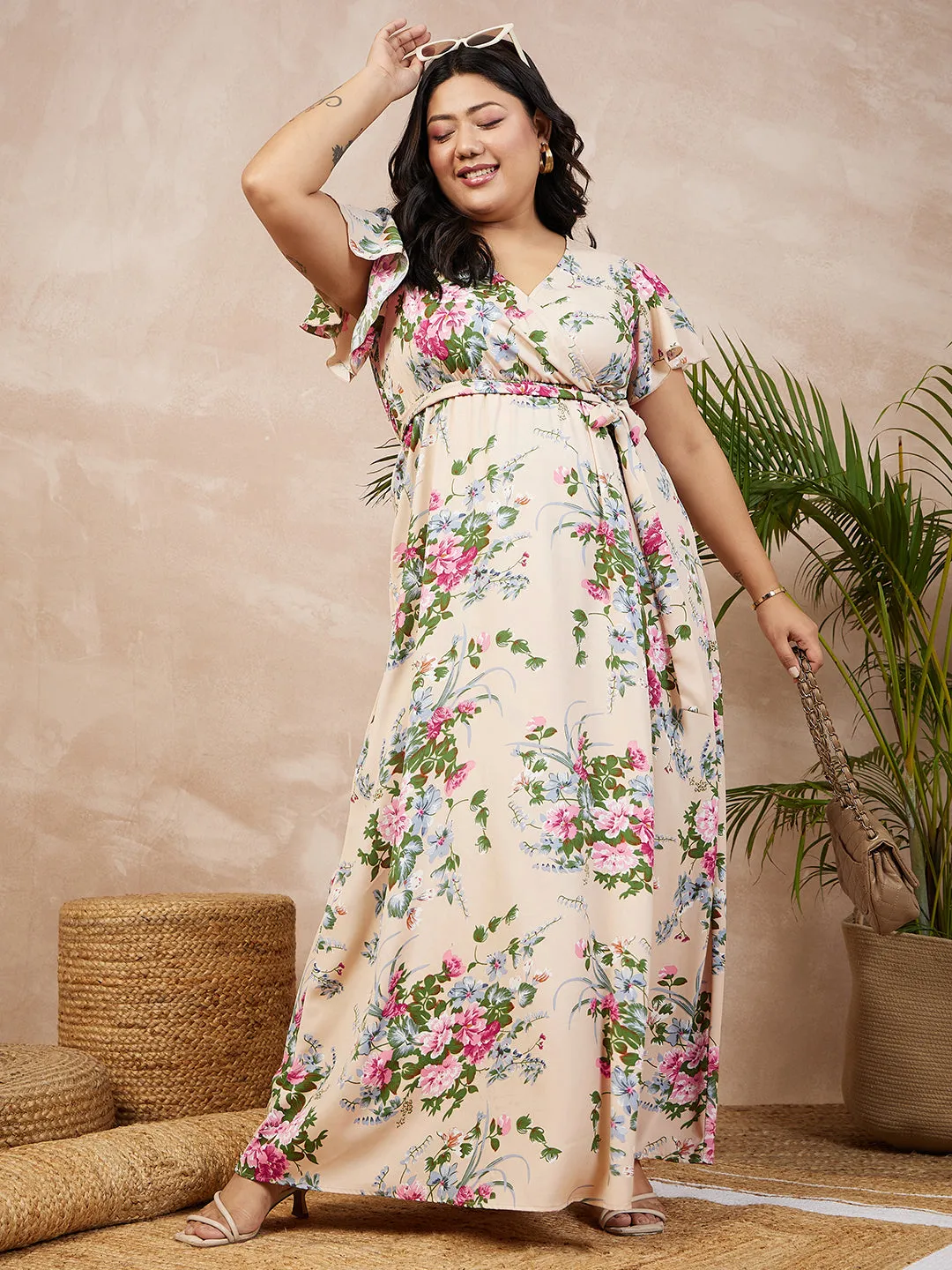 Berrylush Women Plus Size Beige & Pink Floral Printed V-Neck Flutter Sleeve Tie-Up Waist Flared Maxi Dress