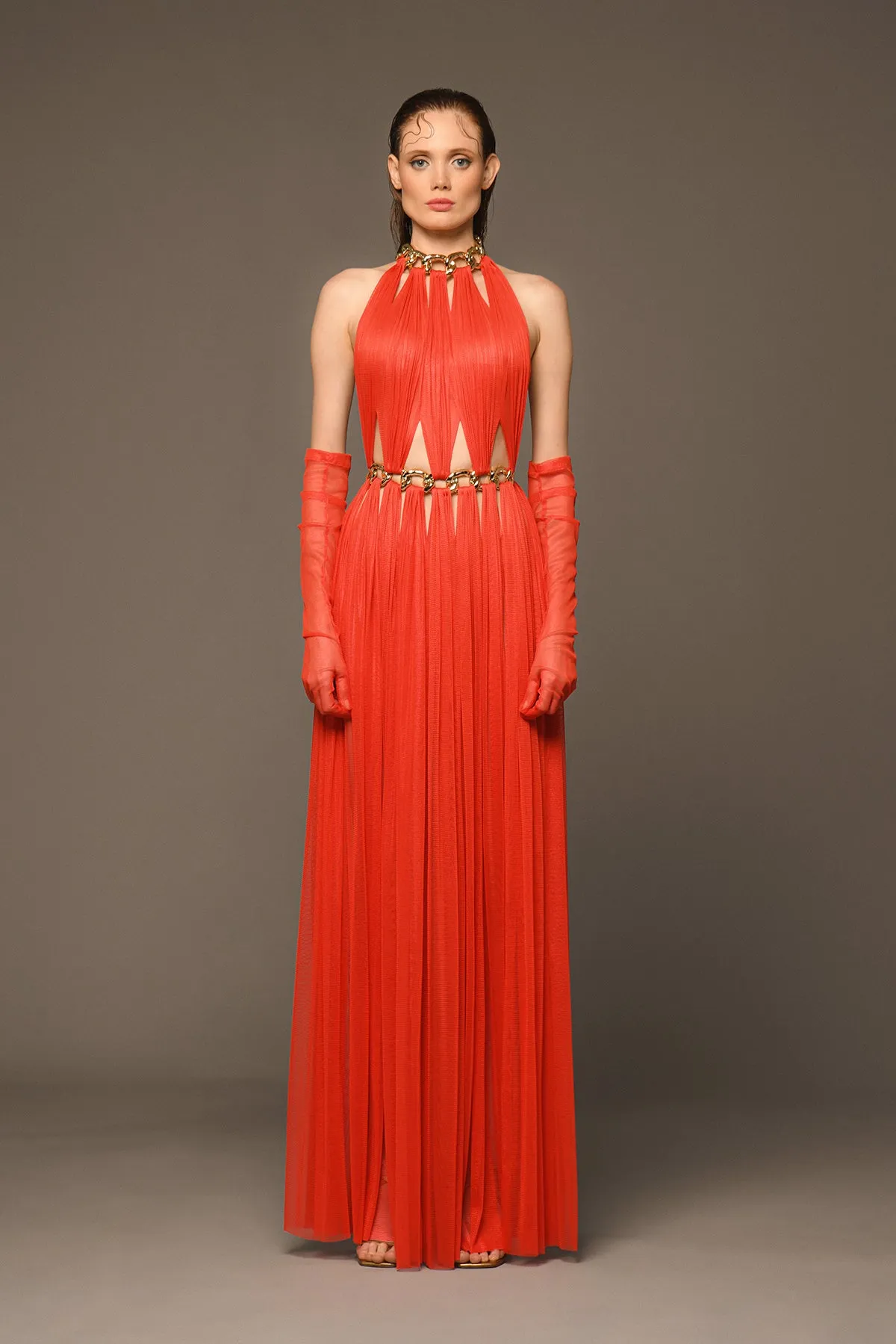 Orange red dress with cutouts, chains and gloves